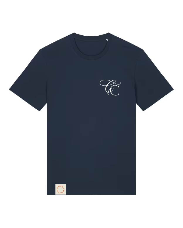A navy blue short-sleeve crewneck t-shirt with a small white cursive monogram logo on the left chest and a small beige tag near the bottom hem, shown on a plain white background.